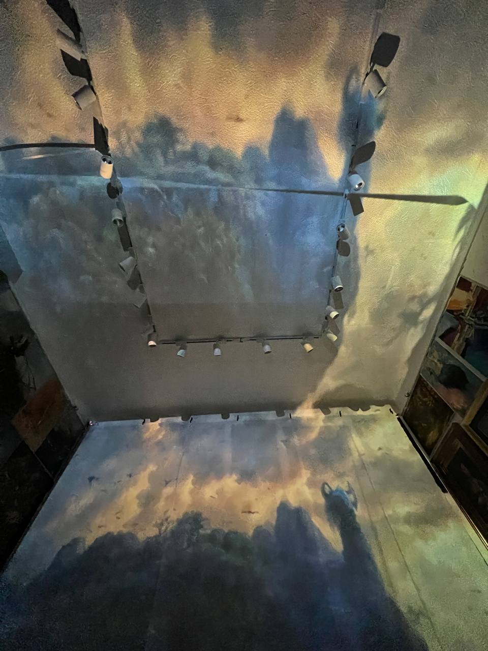 Paintings projected on the walls and ceiling of Gallery 36 during the immersive show