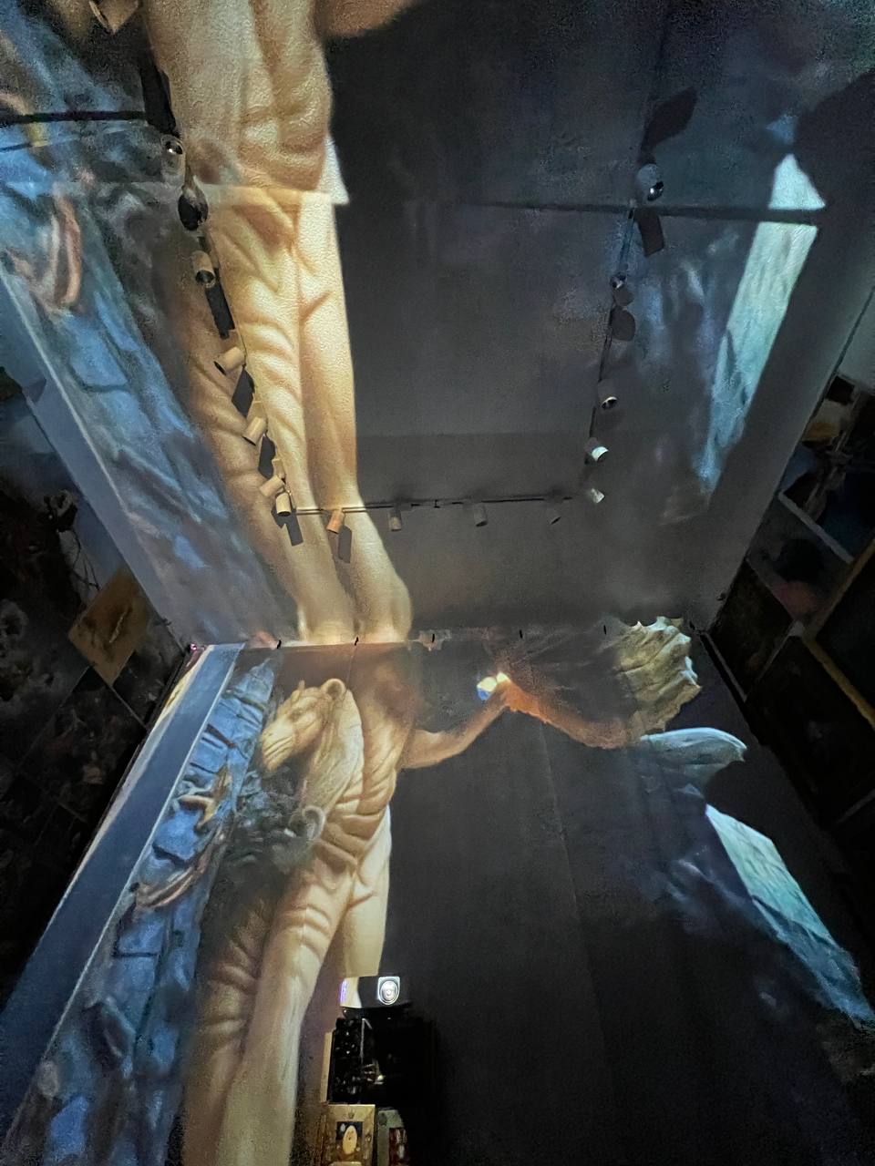 Paintings projected on the walls and ceiling of Gallery 36 during the immersive show