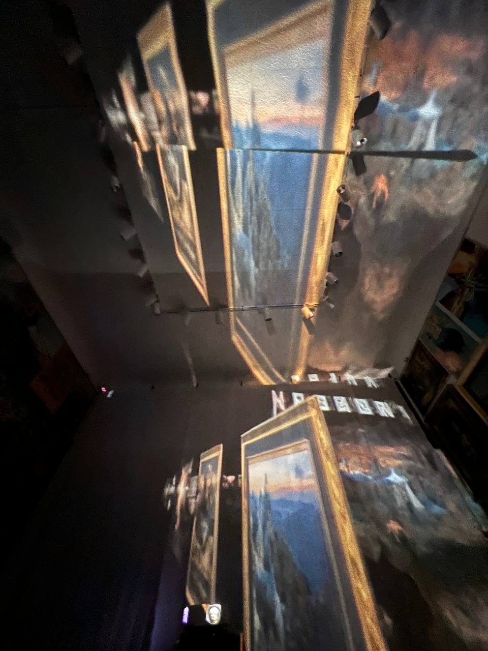 Paintings projected on the walls and ceiling of Gallery 36 during the immersive show