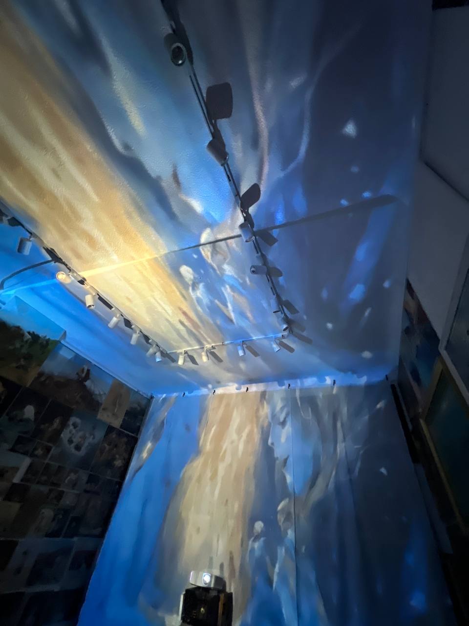 Paintings projected on the walls and ceiling of Gallery 36 during the immersive show