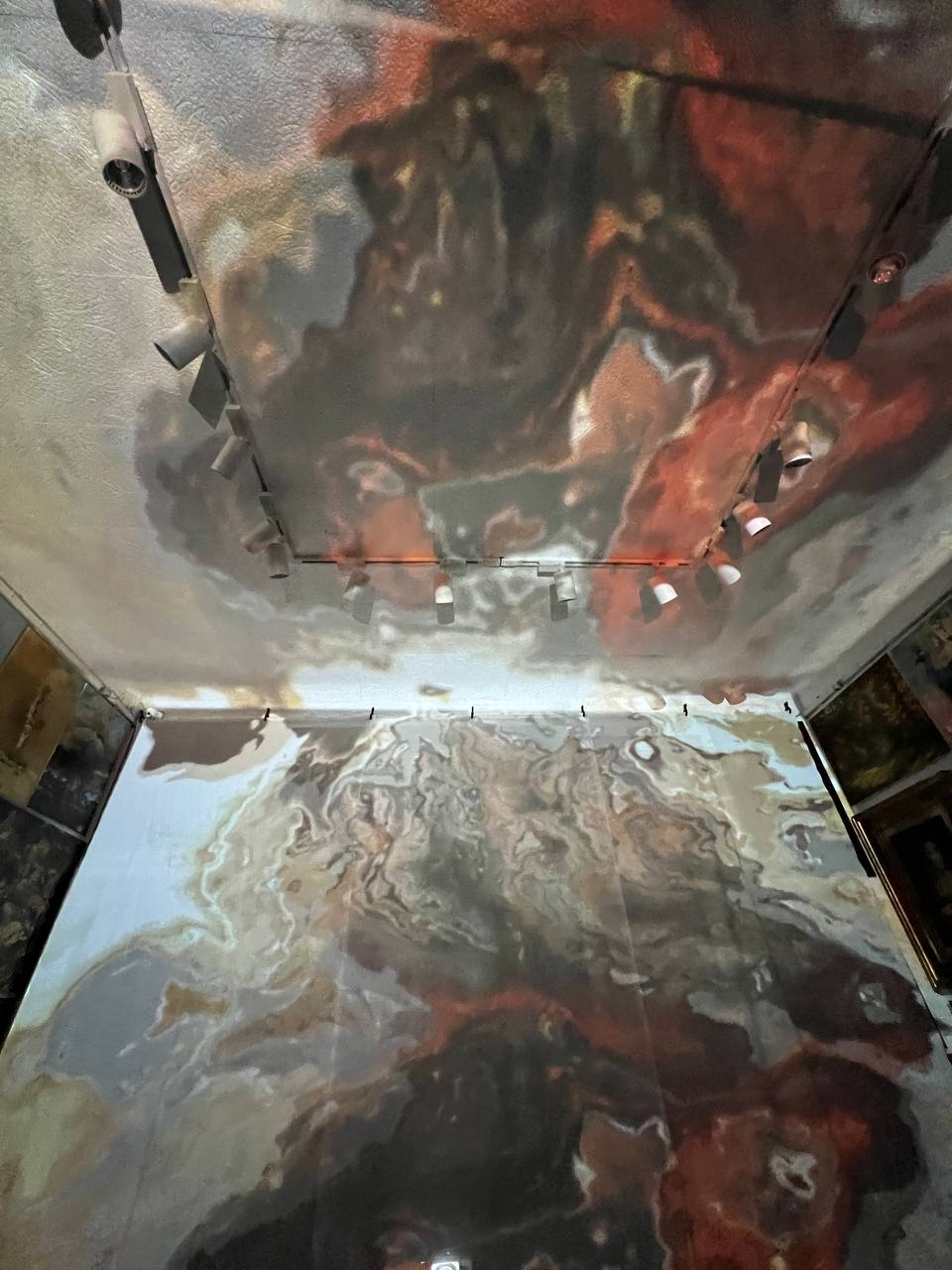 Paintings projected on the walls and ceiling of Gallery 36 during the immersive show